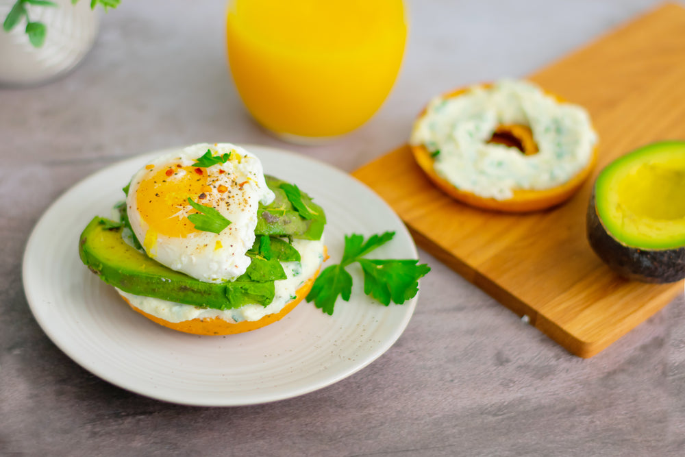 bagel sandwich with lemon herb ricotta and poached egg
