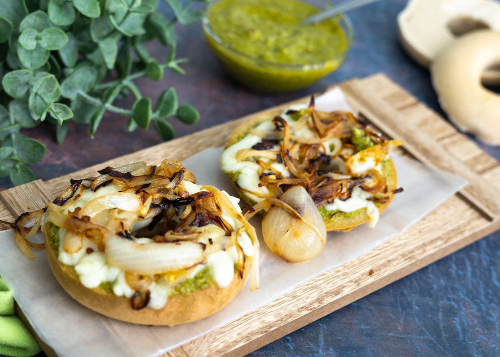 gluten free pizza bagel with caramelized mushroom and onions